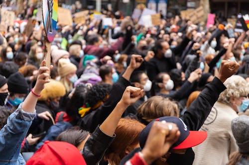 Crowd Raising their Hands 