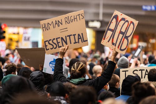 People Holding Cardboards with Message