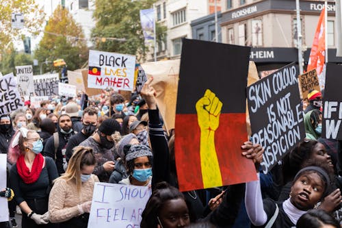 Crowd Raising Posters with Message