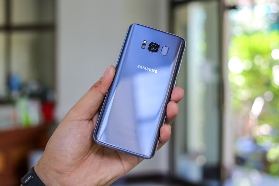 Person Holding Blue Samsung Galaxy S8