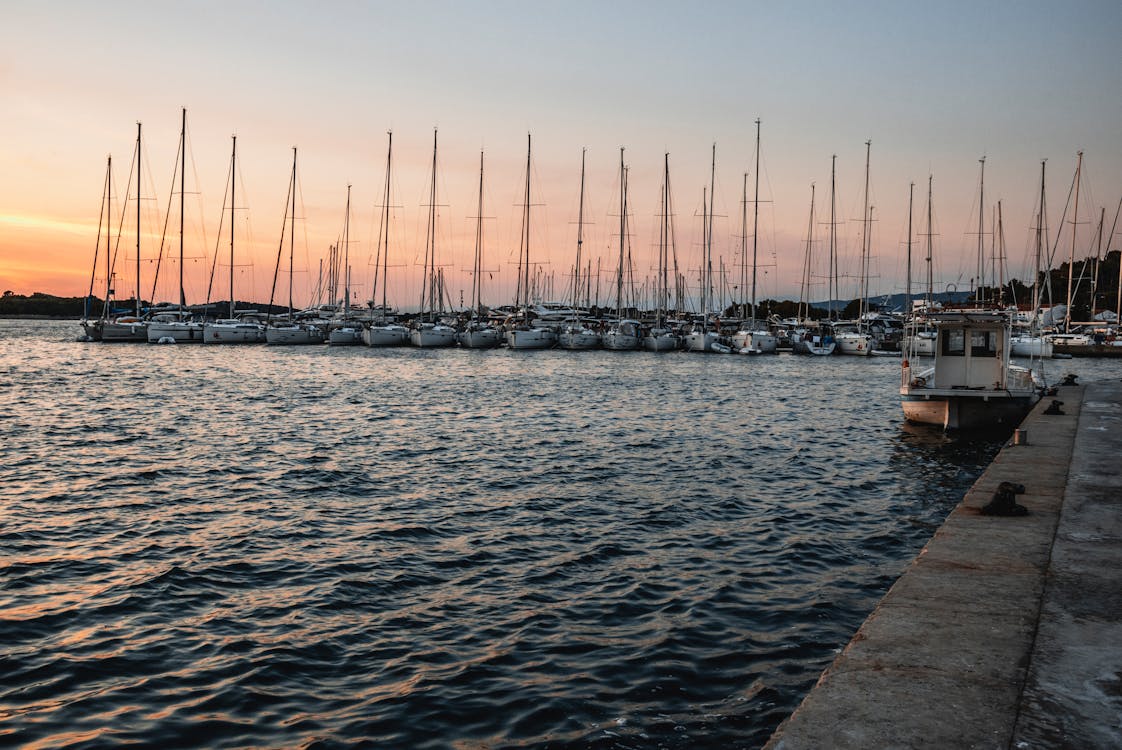 
Sail Boats Docked during a Sunset
