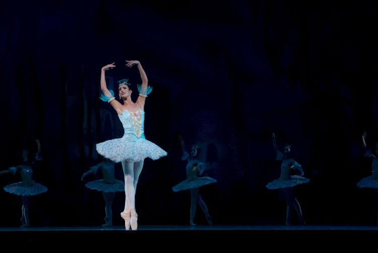 Woman In Blue Ballerina Dress Performing Dance