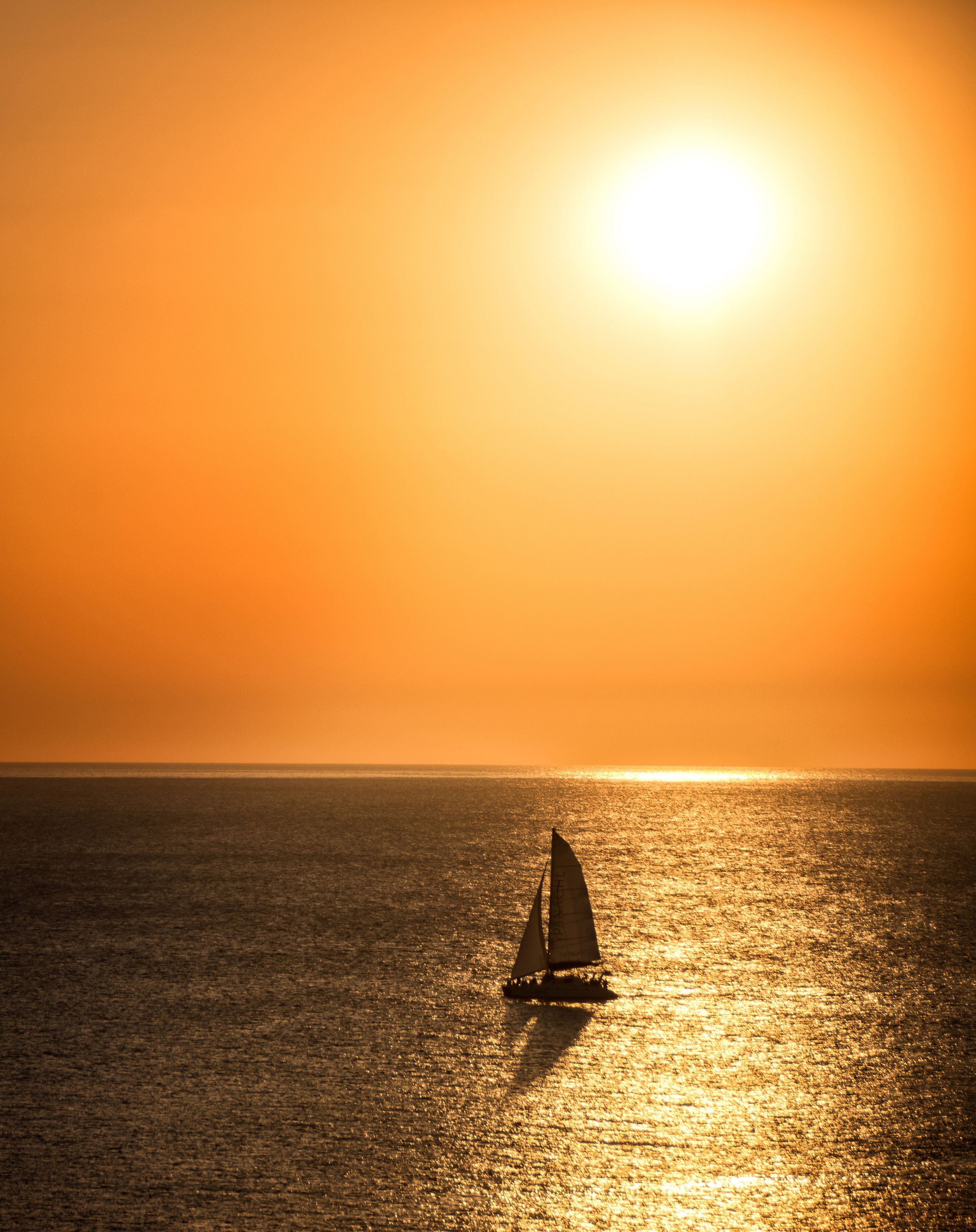 Silhouette of Sailboat on Sea during Sunset · Free Stock Photo