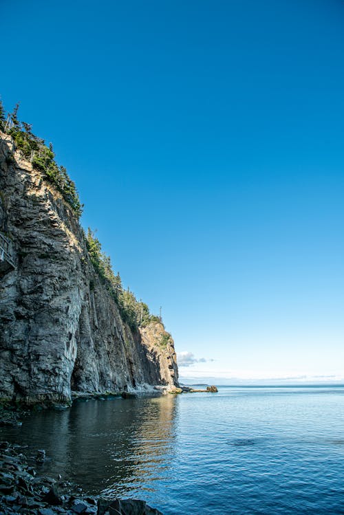 Бесплатное стоковое фото с береговая линия, вертикальный выстрел, живописный