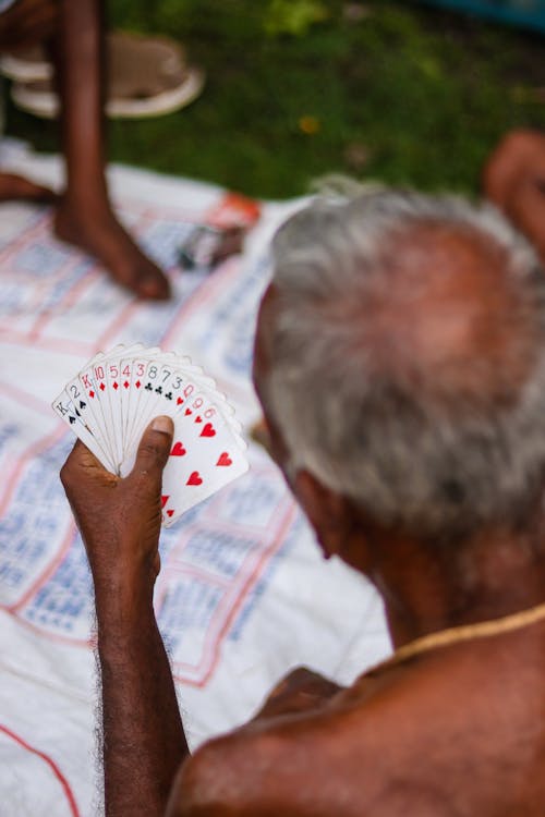 An Old Man Playing Cards