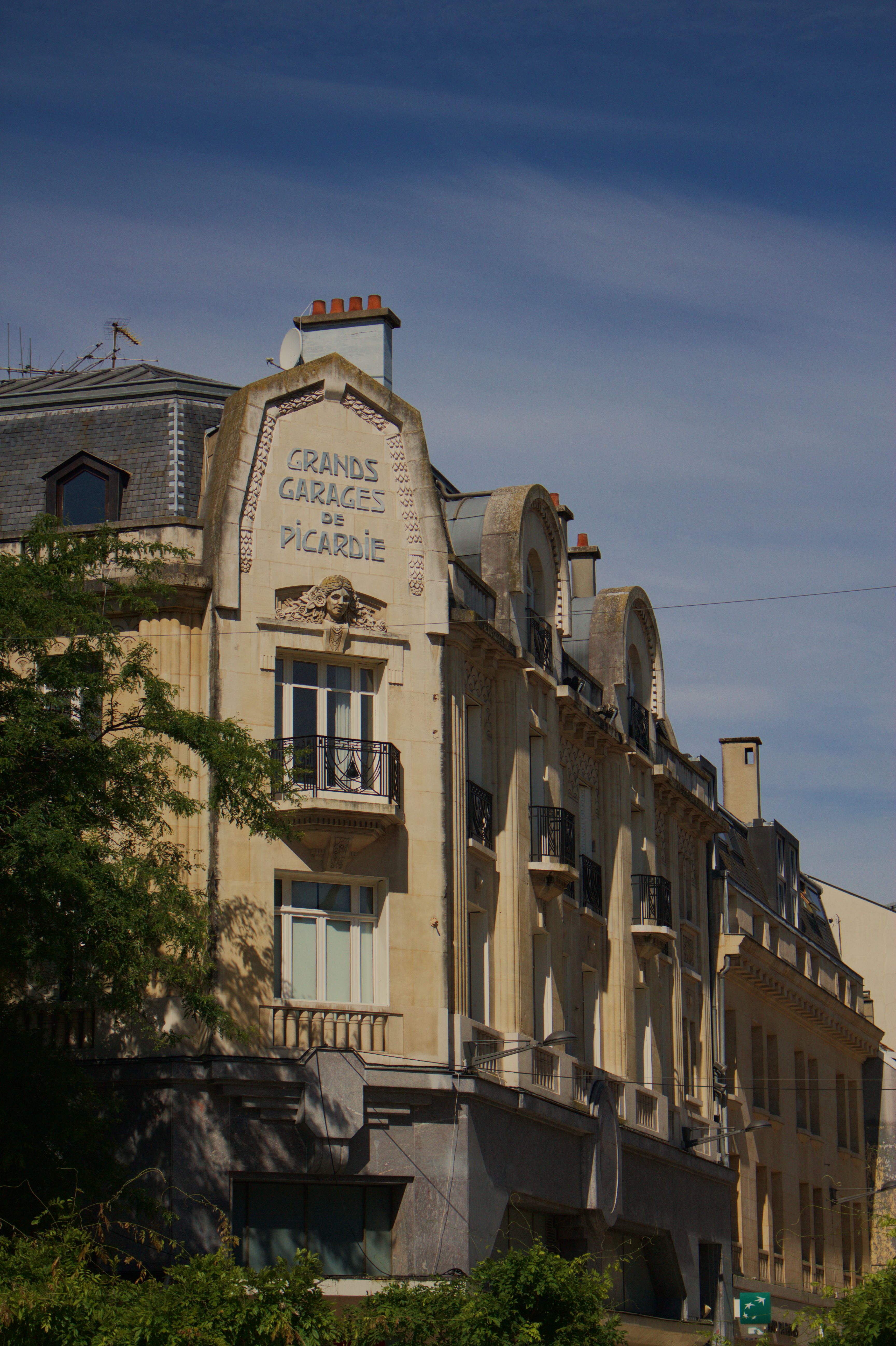 Charming early 20th-century architecture in Amiens, Hauts-de-France, France, under clear skies.