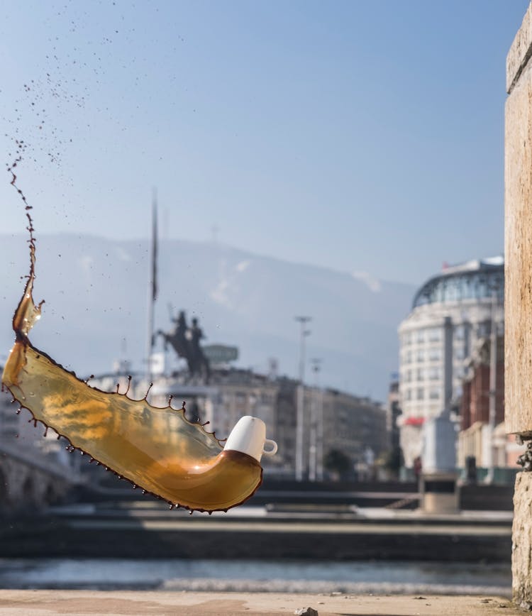 Flying Cup With Spilled Coffee In Air