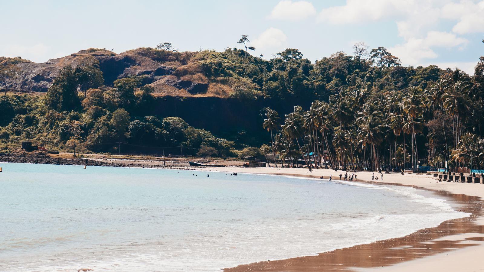 Sea water washing sandy beach in sunny day, Sao Tome and Principe
