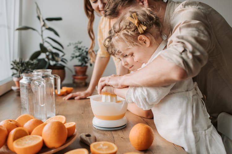 Kids Making Juice With Their Parents