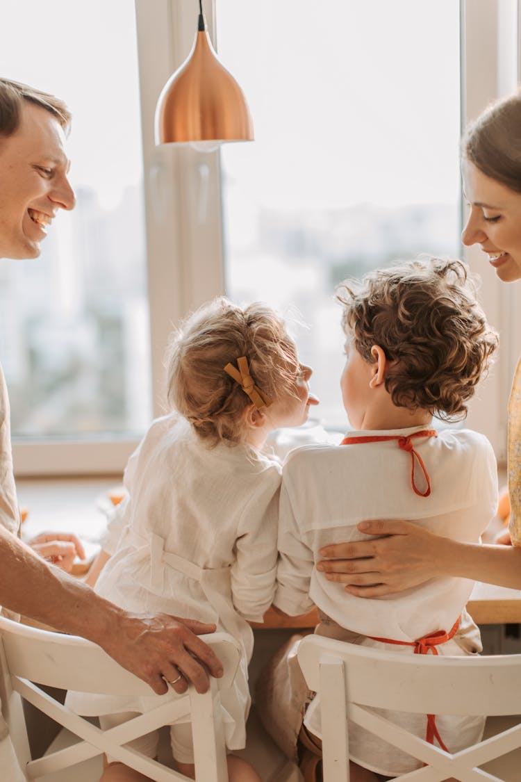 Back View Of A Happy Family