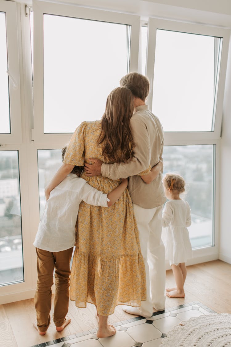 Back View Of A Family Together 