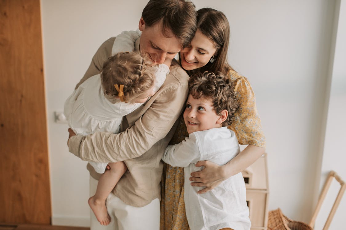 Free Happy Family Hugging Stock Photo