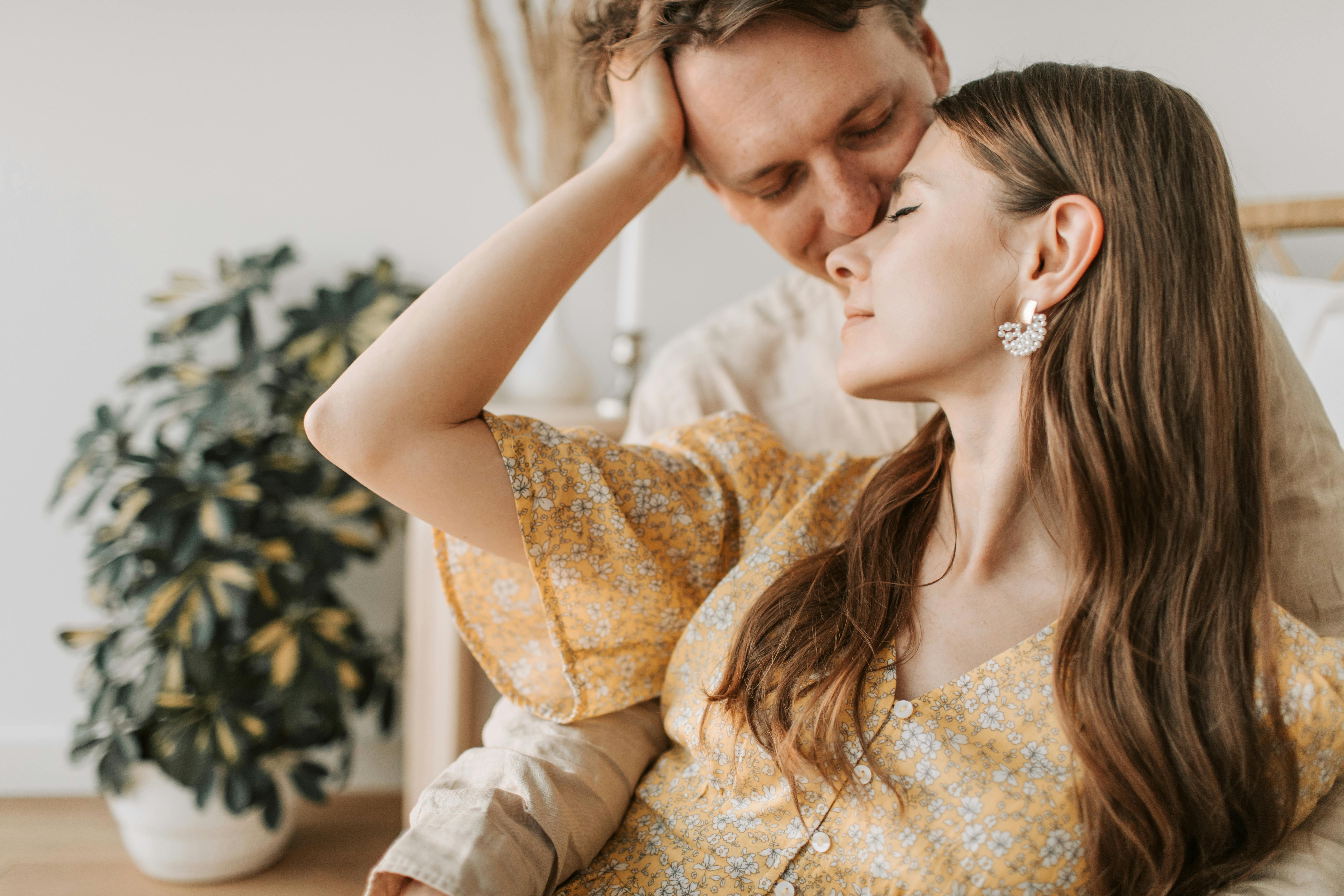 a man kissing the woman