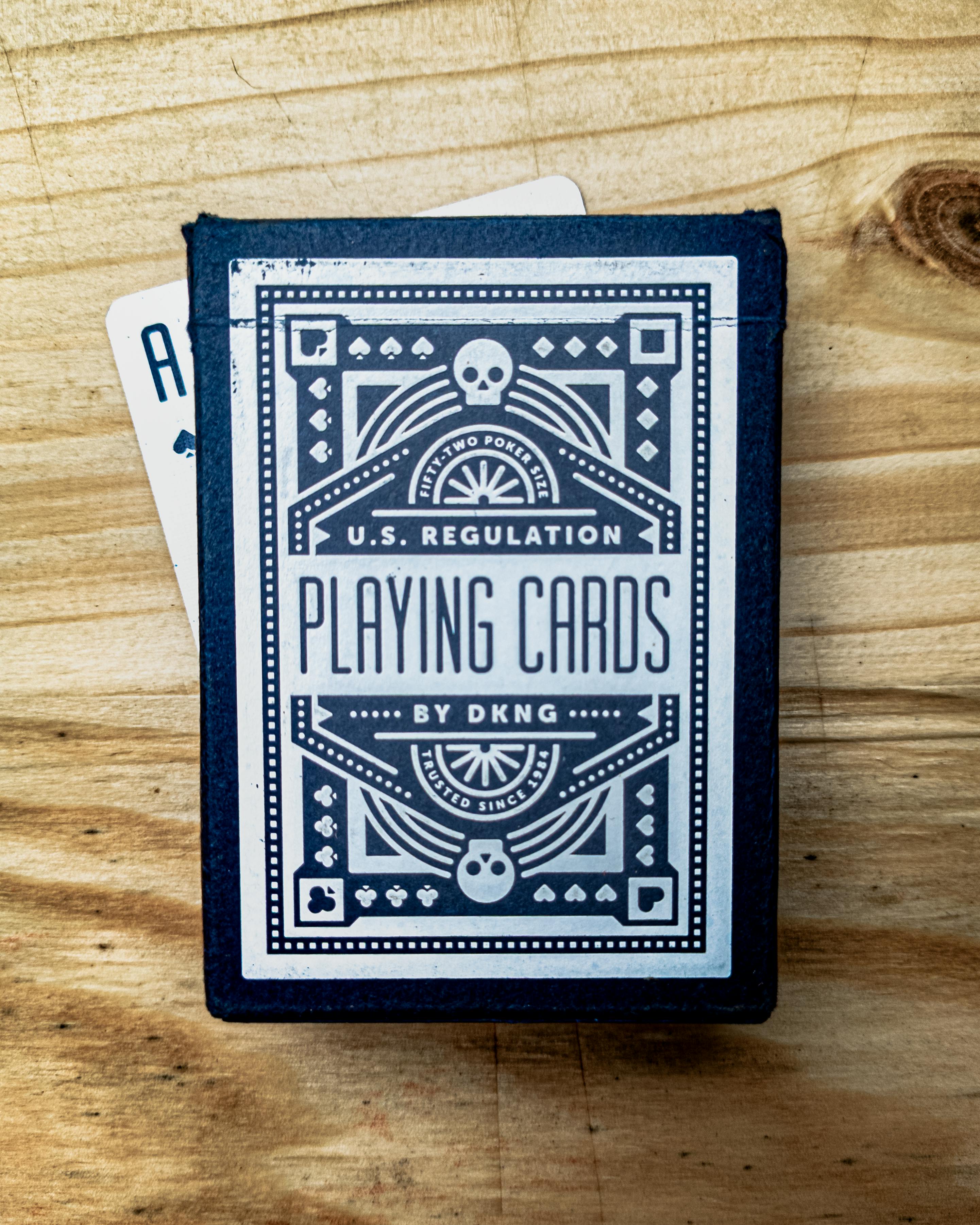 playing cards placed on rustic wooden table