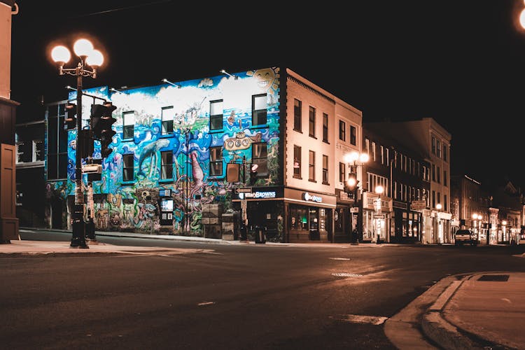 Creative Street Art On Modern Building In City At Night