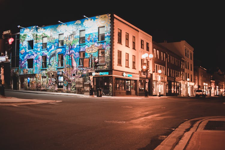 Building With Graffiti In City District At Night