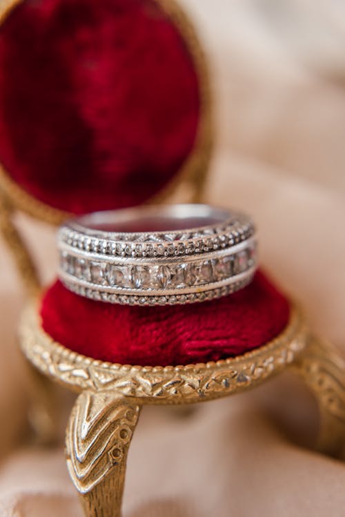 Close-Up Shot of Gold and Red Ring