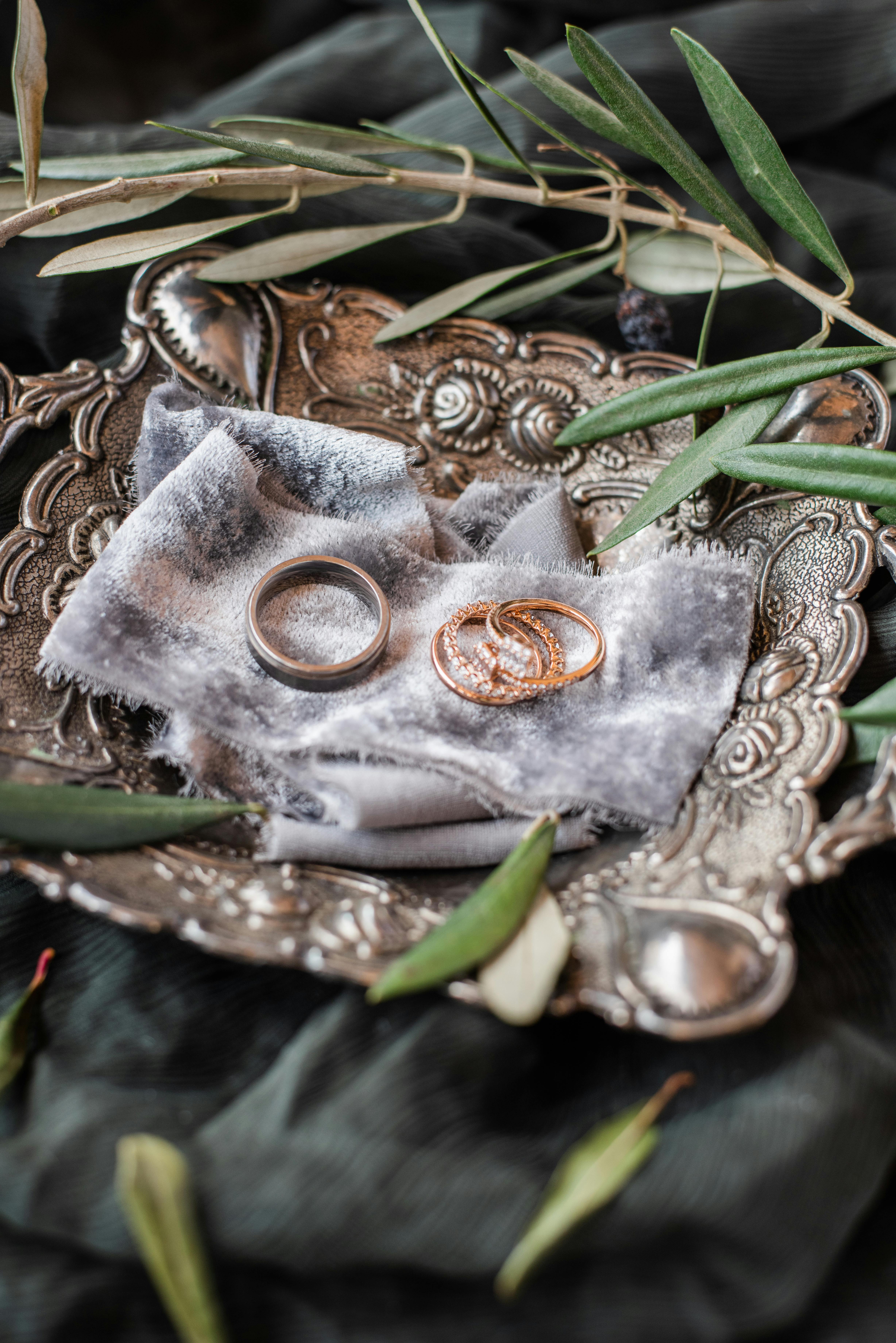 photo of rings on decorative silver plate