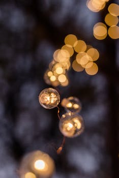 Festive string lights glowing with a soft bokeh effect, perfect for holiday or celebration themes.