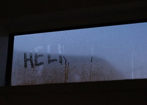 Text On Glass Window With Dew 