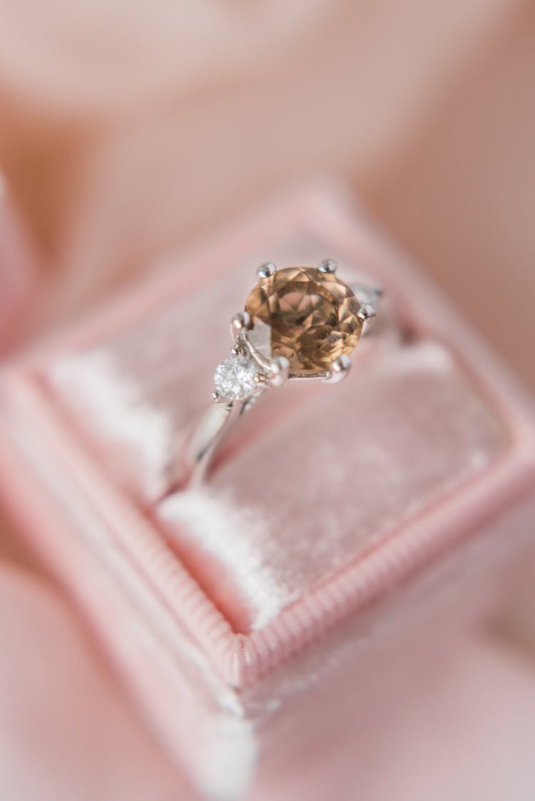 Silver Ring With Diamond On Pink Leather Case