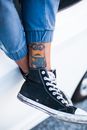 A Close-Up Shot of a Person with a Tattoo on the Leg
