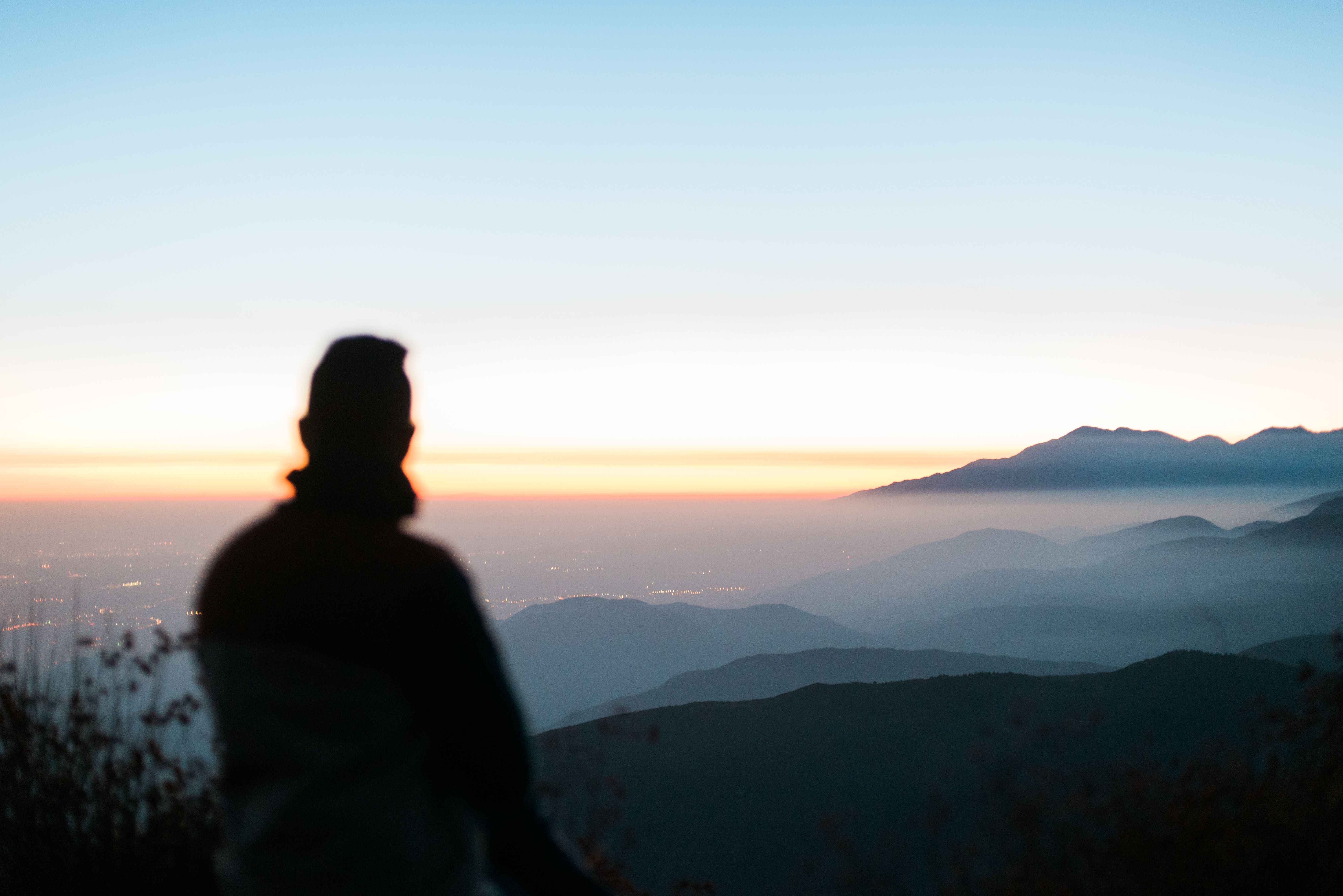 A Silhouette of a Man on a Mountain Peak during the Golden Hour · Free ...