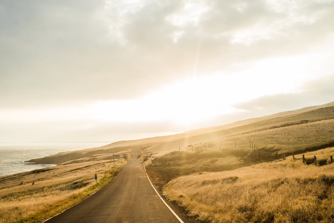 Free A Road under a Cloudy Sky during the Golden Hour Stock Photo