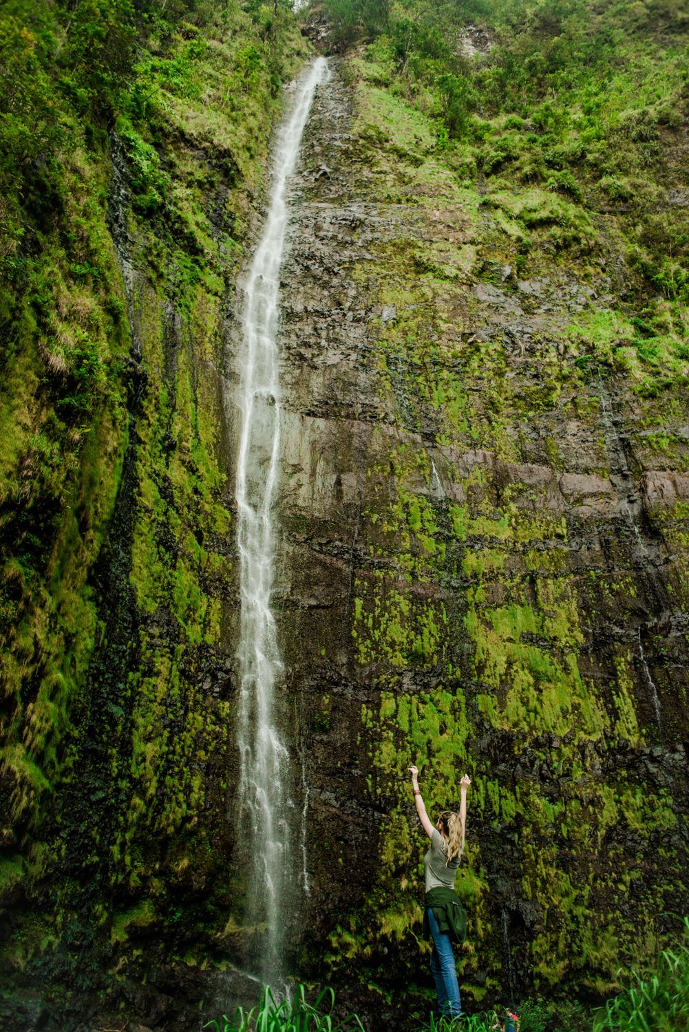 A Woman Standing Near a Waterfall · Free Stock Photo