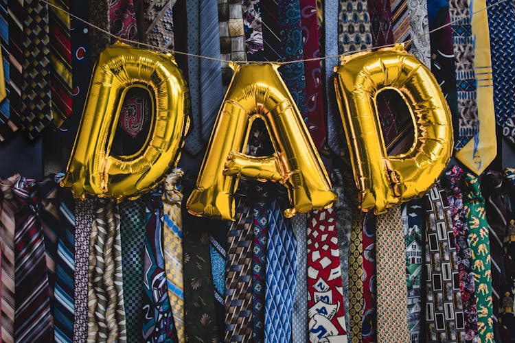 Golden Letter Balloons Forming The Word Dad