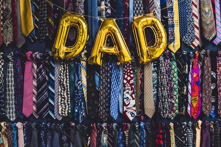 The Word Dad In Golden Balloon Letters 