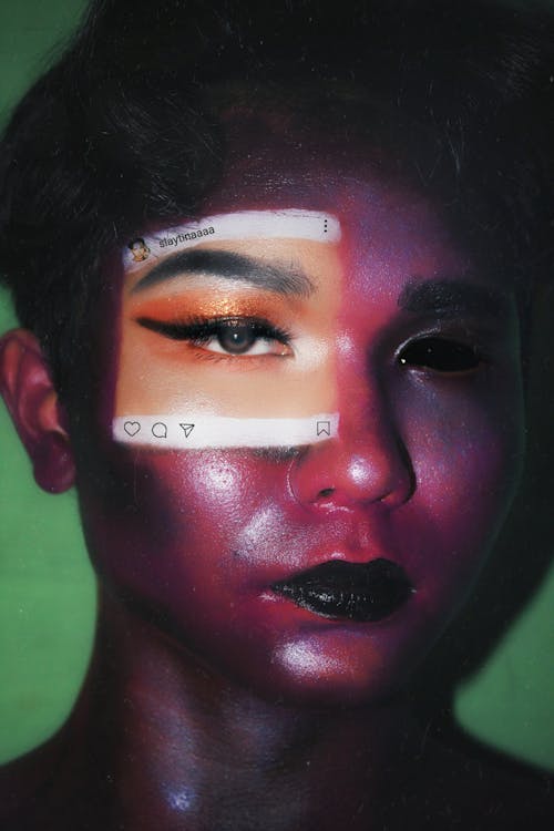 Young ethnic woman with social network art on face