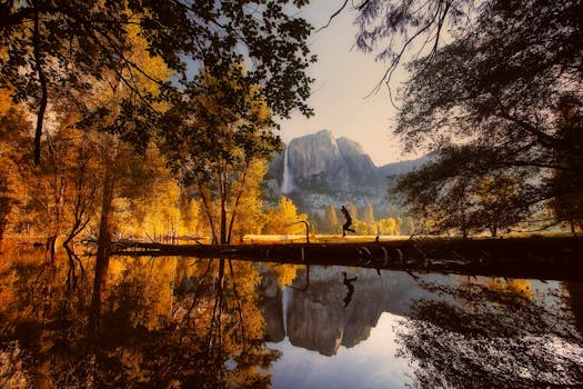 Dramatic view of Yosemite with vibrant autumn colors and majestic reflections.