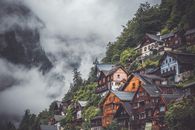 Brown and White Concrete Houses Under White Clouds