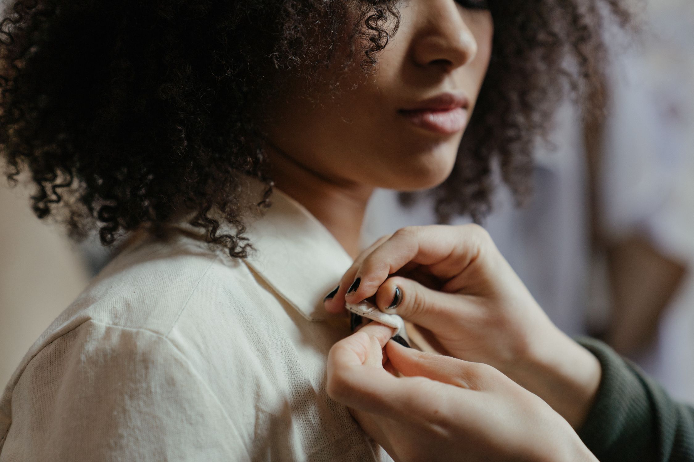 Woman in White Shirt Holding Her Hair · Free Stock Photo