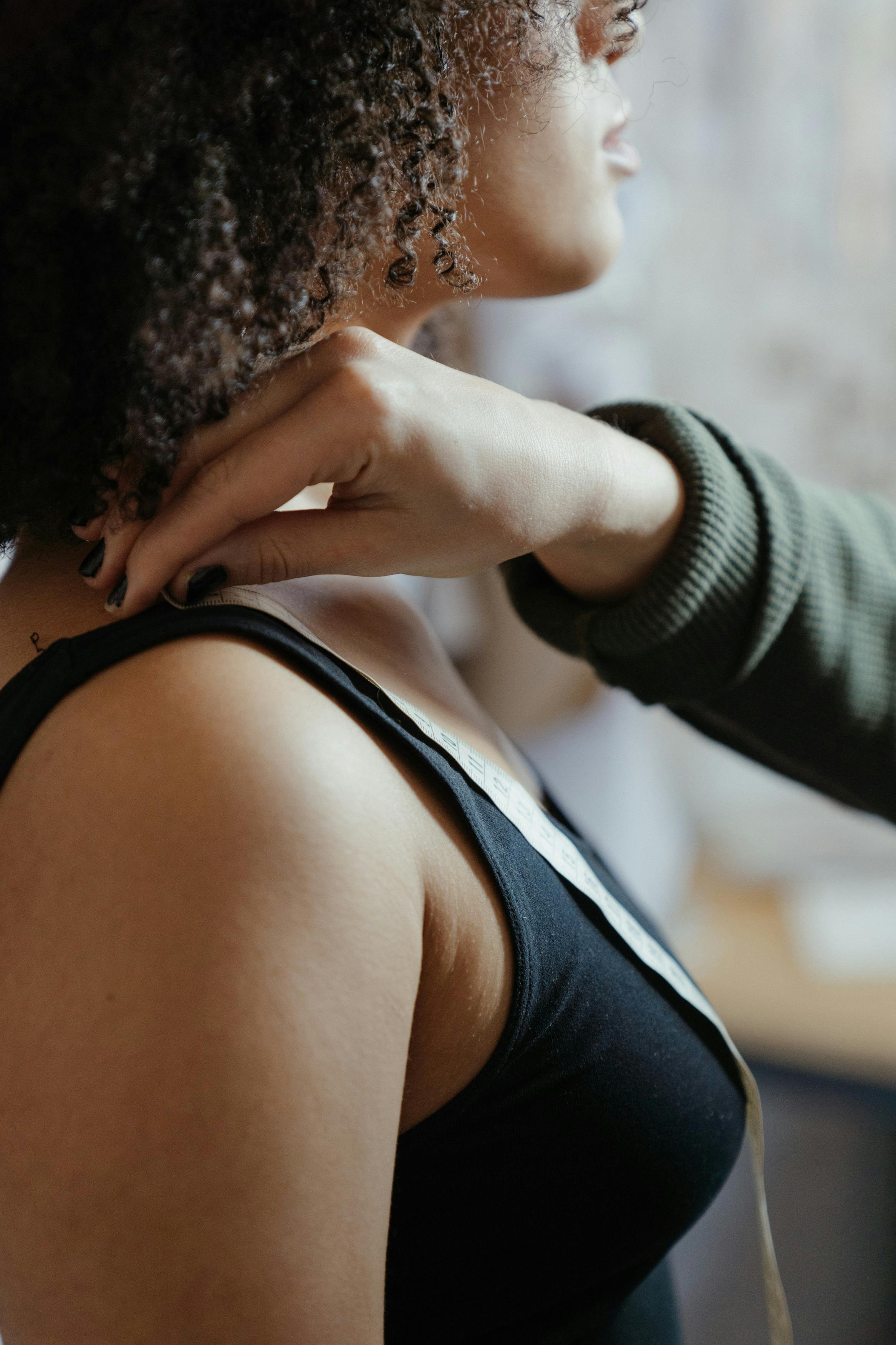 photo of woman wearing black tank top