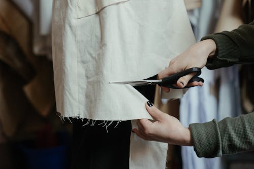 Person Holding Black Pen and White Paper