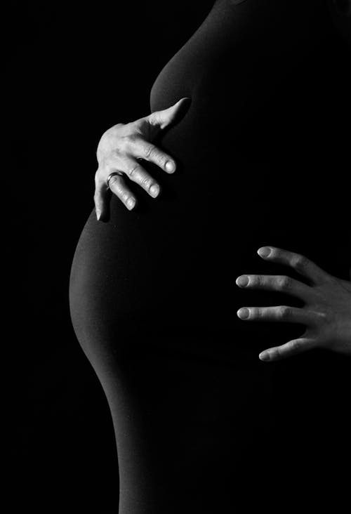 Free Gray Scale Photo of a Pregnant Woman Stock Photo