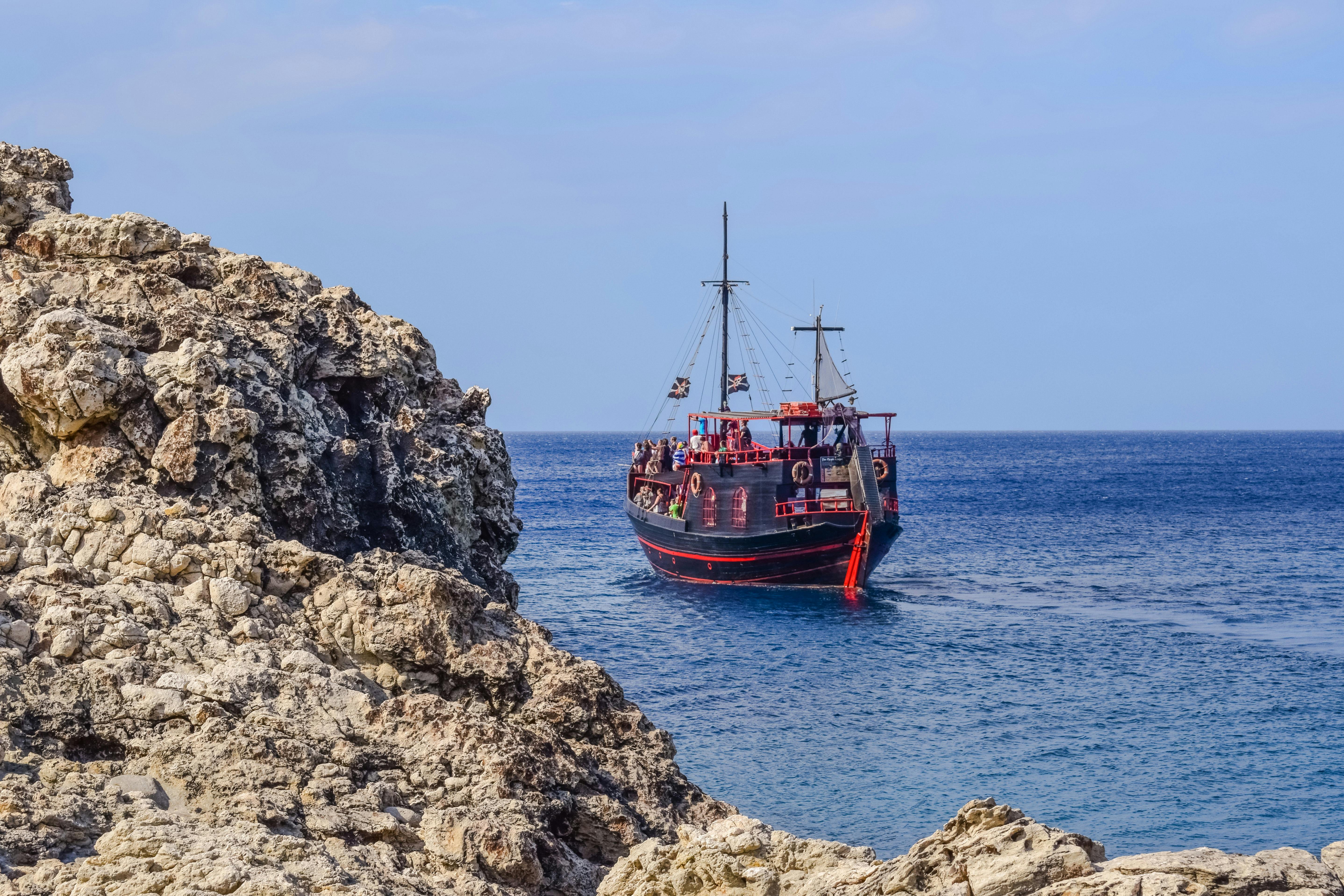 Black and Red Ship on Water