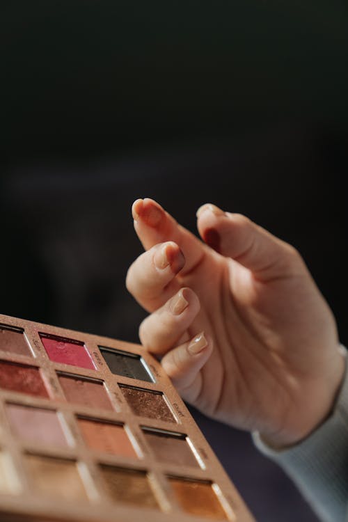 Person Holding Brown Wooden Board