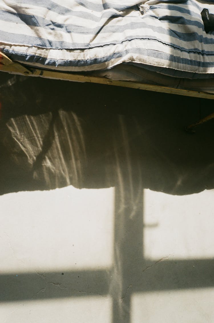 Old Mattress On Wooden Bed