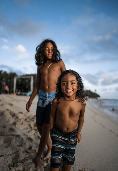 Free Kids Standing on Beach Stock Photo