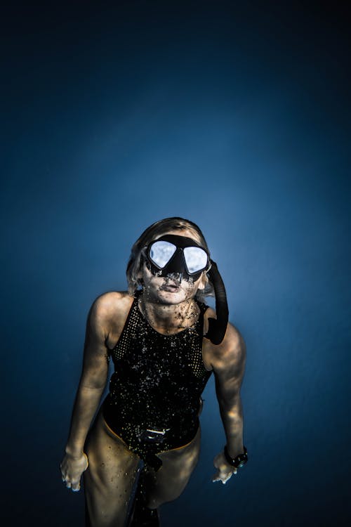 Photo Of Woman Swimming Underwater