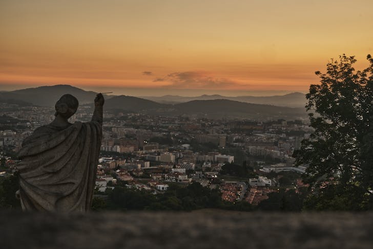Lady Figure Statue Facing City Panorama