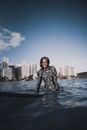 Man with Surfboard in Sea