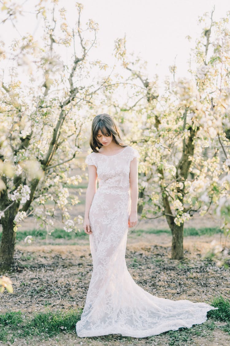 Photo Of Woman Wearing White Long Dress