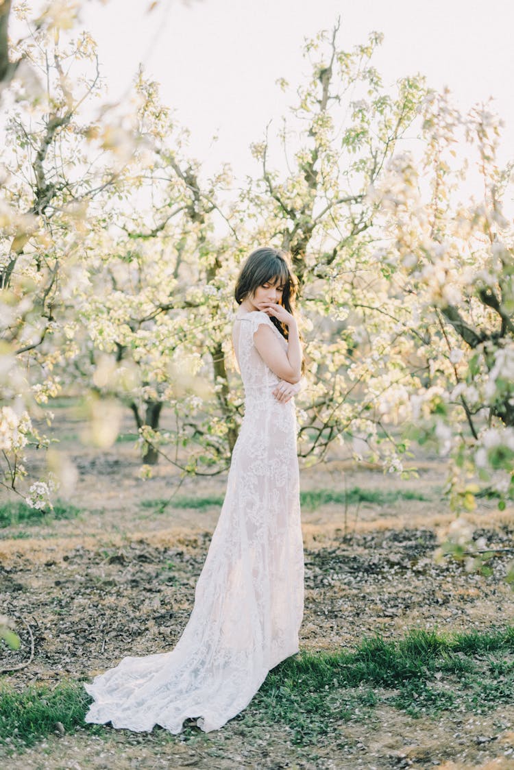 Photo Of A Woman In White Dress