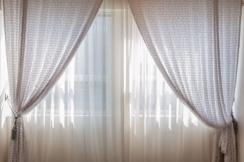 Sheer curtains in a sunlit living room