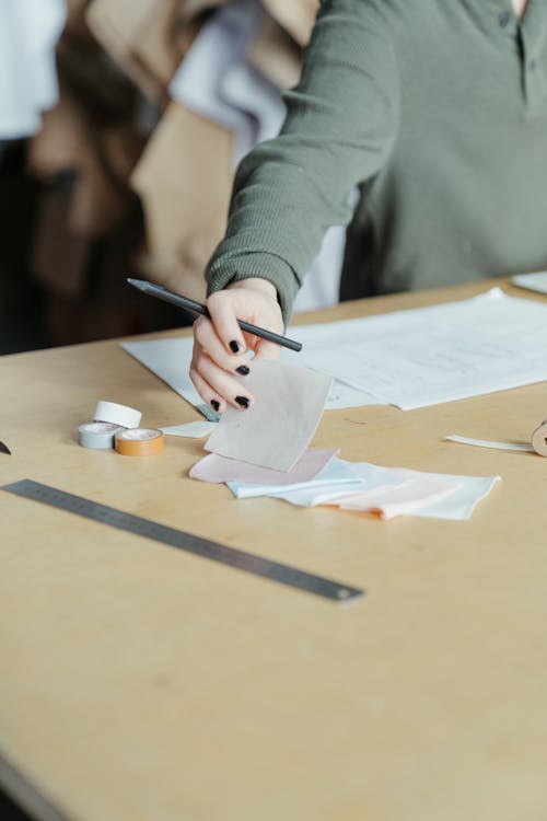 Person Writing on White Paper