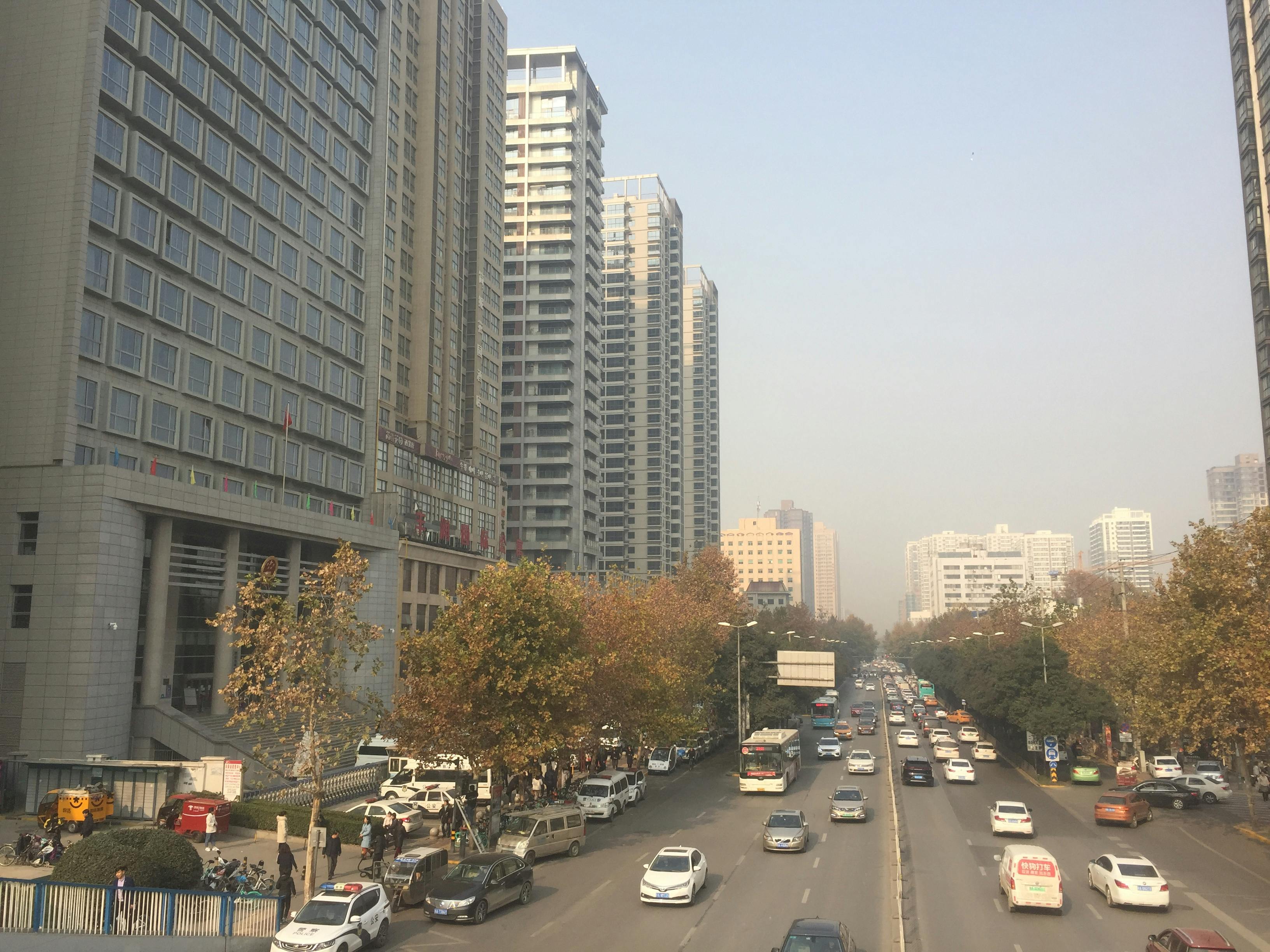Stack of fantasy novels with a candle and flowers